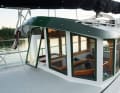 The high deckhouse is fitted with safety glass panes all round