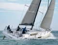 Upright. The enormous width, the shallow underwater and the chines provide a lot of dimensional stability