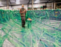 In the vacuum infusion process, dry glass fibres and foam sheets are placed in the mould as the core material and sealed with a film. The resin is then sucked into the laminate structure under vacuum and the structures are cured