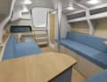 Le support de mât se trouve au milieu du salon. Il est possible d'y accrocher une table de salon flexible, qui peut également servir de table de cockpit.