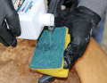 A dishwashing sponge can do a good job, but be careful with the rough side: it can dull shiny surfaces