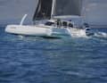 The side hulls feature sickled and asymmetrically profiled centreboards. The foils generate additional lift