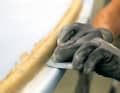 The template will only produce an even and smooth filler contour if it can be pulled along the skirting board evenly and without snagging.  Therefore, remove any resin residue from the contact surface on the body