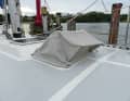 A higher guard is fitted over the hatch. This allows more air below deck and an insect net can be integrated
