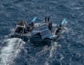 The Kiwis on a "pile of rubble". Their wing rig collapsed after the three races of the day