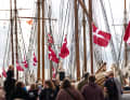 Thousands of people admire the fleet in Assens, Denmark, and numerous Danish flags adorn the harbour