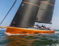 The long bowsprit is permanently attached and also serves as an anchor bracket.