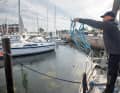 Use force to fling both bundles forwards in the direction of the pole