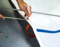 Relax the sail battens or, better still, take them out completely. Then the cloth can be folded and packed much smaller