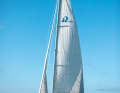 Before furling out, drop to a deep room sheet course. This reduces the apparent wind on deck. Loosen the genoa halyard slightly and do not drive the backstay too tightly. This reduces the load on the bearings of the furling system and less force is required