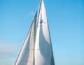 Set the desired angle of attack for the genoa, trim the halyard, set and hoist the sails