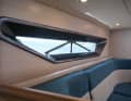 The trapezoidal hull windows dominate the saloon