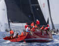 Hendrik Brandis' fiery red "Earlybird" sailed to World Championship gold off Porto Cervo.