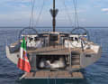 The dinghy is retracted between the two rudder shafts in the direction of travel. This makes launching and retrieving the dinghy easy