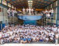 The staff of Southern Wind Shipyard. On deck are COO John Craig, CEO Marco Alberti, the Premier of the Western Cape Province, Alan Winde, and Alberto Vecchi, Italian Ambassador to South Africa