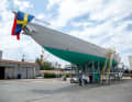 The almost 40 metre long aluminium hull and the superstructure were covered with protective film for the upcoming transport. The bow flag indicates that the boat is owned in Sweden