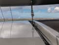 Elegant. The important traveller for the mainsheet is recessed into the solid targa bracket.