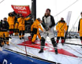 Clarisse Crémer is celebrated by her team after winning her Vendée Globe premiere