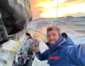 Sam Goodchild has started trying to repair his mainsail, which was torn at the third reef.