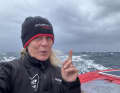 Here, the 50-year-old British woman, who lives in France, points to the sky and the harsh conditions.