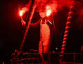 Olli Heer celebrates his solo around the world with the classic beacon after crossing the finish line.