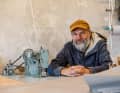 Arrived: Hinrichsen behind the sewing machine in his workshop on the island of Alsen