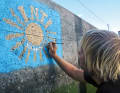 The crew of the "Inti" immortalises itself on the quay wall of San Sebastián on La Gomera