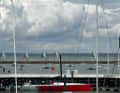 Here "Red Bandit" is back in Cowes harbour after breaking her mast, while the short races continued out in the Solent.