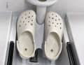 Simple plastic Crocs, screwed onto the footrest of the rowing bench, are designed to provide support