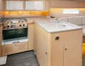 The galley has plenty of storage space and two pull-out waste bins amidships