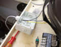 Glands at the inputs of sockets and fuse boxes are better than simple rubber grommets because they take the strain off the cable