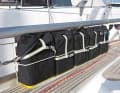 Equipment: Diesel canisters - an extra supply increases the range under the engine. Here, a stainless steel rod has been inserted between the railing supports to attach the canisters at sea. They are not a major cost factor