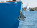 Only the Bruce anchor fits into the recess in the stern. So it doesn't get in the way on deck
