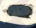 The patch is pressed onto the adhesive. The sealant is distributed evenly by pressing it on with a spatula