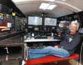 Adventurer and boat-building pioneer Sedlacek in the command centre of his Imoca