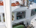 The anchor locker is located on the starboard side and a deep storage space for fenders on the port side