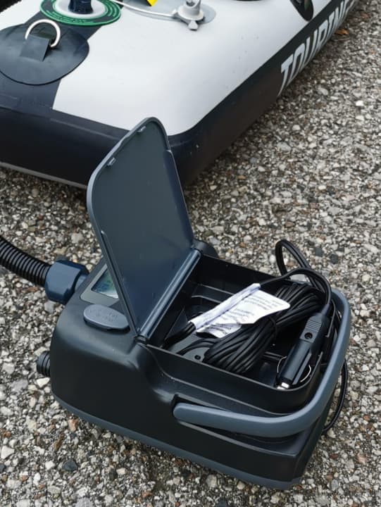 Charging cables for the socket and cigarette lighter are elegantly stored in a - small - compartment