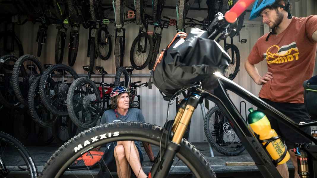 With the bike to the wall