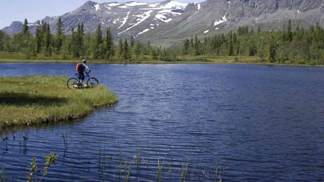 Cycle tour through idyllic fjord landscape