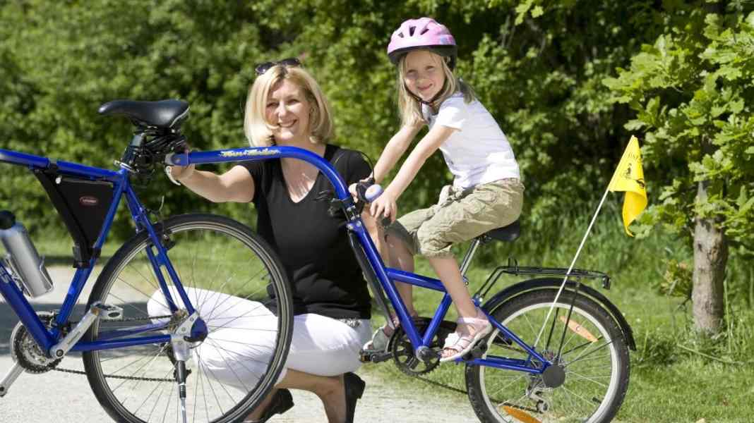 Trailer bike or tandem bar: which is better?