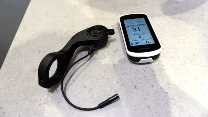 The Garmin Power Mount (left) forms the connection to the e-bike.