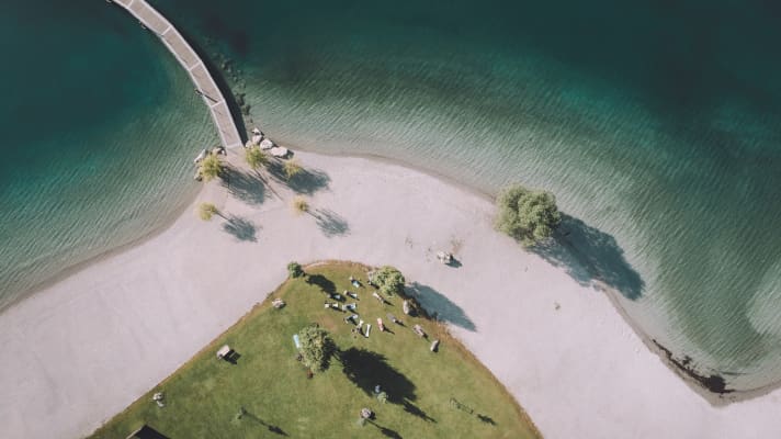 A bird's eye view of the yoga session on the shores of Lake Molveno.