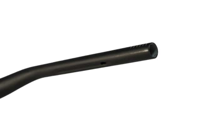 The guide groove and hole allow cables, for example from a motor remote on an e-bike, to be routed invisibly through the handlebars.