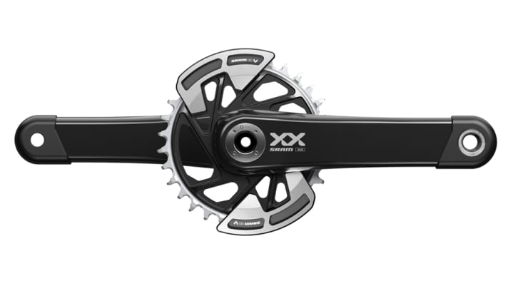 Cool look and protection against tooth failure: The retrofittable bash guards can be fitted either at the top, bottom or on both sides >> <a href="https://www.awin1.com/cread.php?awinmid=11768&awinaffid=471469&clickref=B+Sram+XX+Eagle+Crank&ued=https%3A%2F%2Fwww.rosebikes.de%2Fsram-xx-eagle-transmissiontm-mtb-wide-kurbelgarnitur-2719165" target="_blank" rel="noopener noreferrer nofollow">available here</a>*.