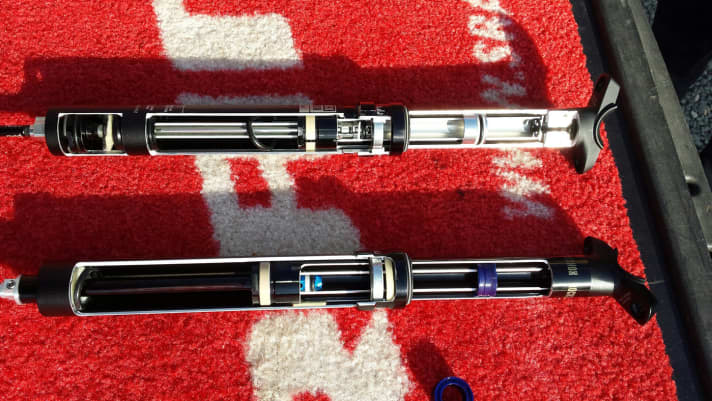   The inner workings of a Rock Shox Reverb: the old one at the top, the new Tele post at the bottom.