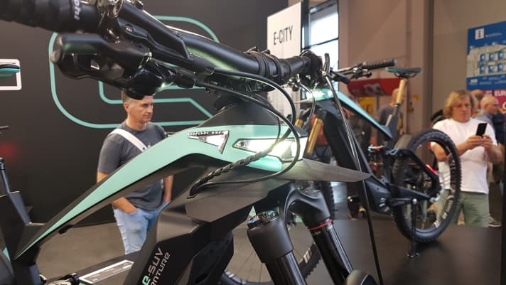   Striking: The front light shines directly out of the bike's head tube.