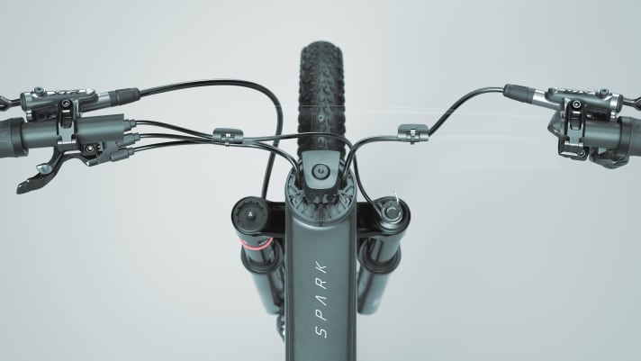   Without handlebars you can see the cable routing on the new Spark more clearly.