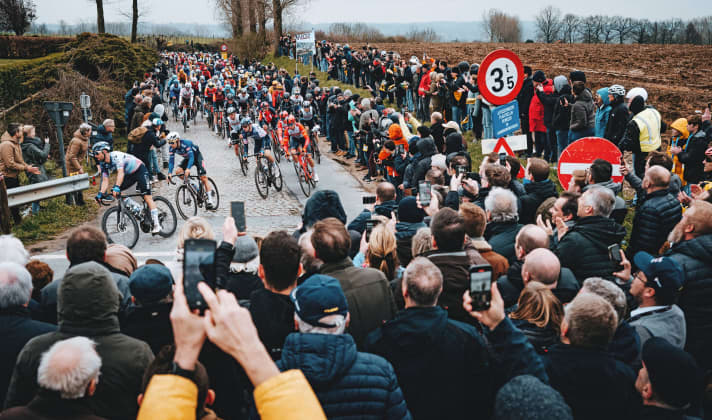Spectators have to find a place in the limited space between the fields and pavement