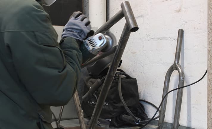 The paint has to come off: what the cheap stain from the DIY store couldn't do, an angle grinder with a knotted wire brush did.