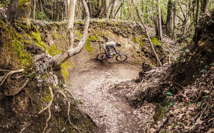 Playing pinball: full throttle through the turn. You can't fly out of this berm.